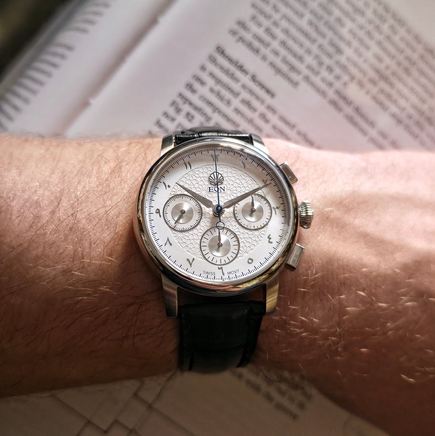 A detailed view of the EON Equinox watch showcasing the beautiful dial with an Arabic pattern, the pearl embedded in the dial and incredible finishing.